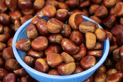 High angle view of roasted coffee beans in container