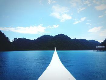 Scenic view of lake against blue sky