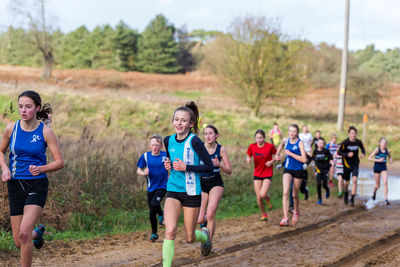 Group of people running on land