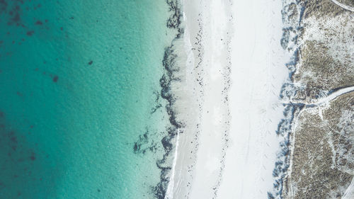 High angle view of swimming pool by sea against sky