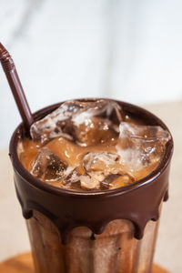 Close-up of coffee in glass on table