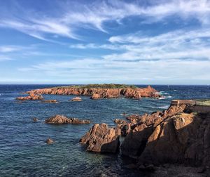 Scenic view of calm sea against blue sky