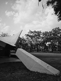 Airplane in park against sky