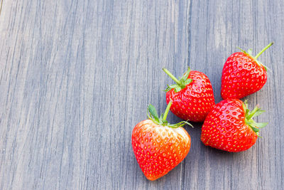 High angle view of strawberries on table