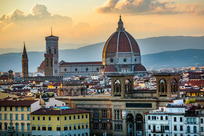 View of cathedral in city at sunset