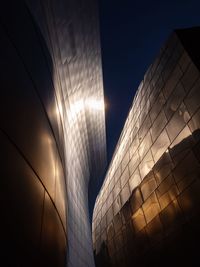 Low angle view of modern building against sky in city