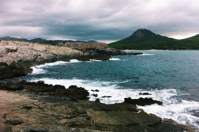 Scenic view of sea against cloudy sky