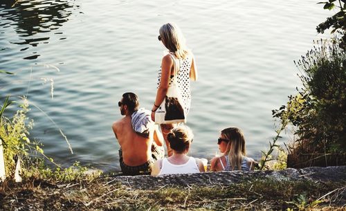 Friends standing in water