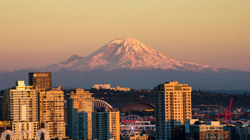 View of city against mountain during sunset