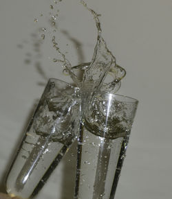 Close-up of water splashing in glass