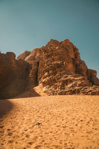 Rock formations in desert against clear sky