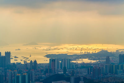 High angle view of buildings against sky during sunset