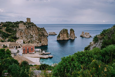 Panoramic view of sea and buildings against sky