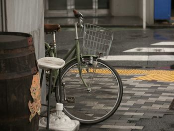 Bicycle parked against metal structure