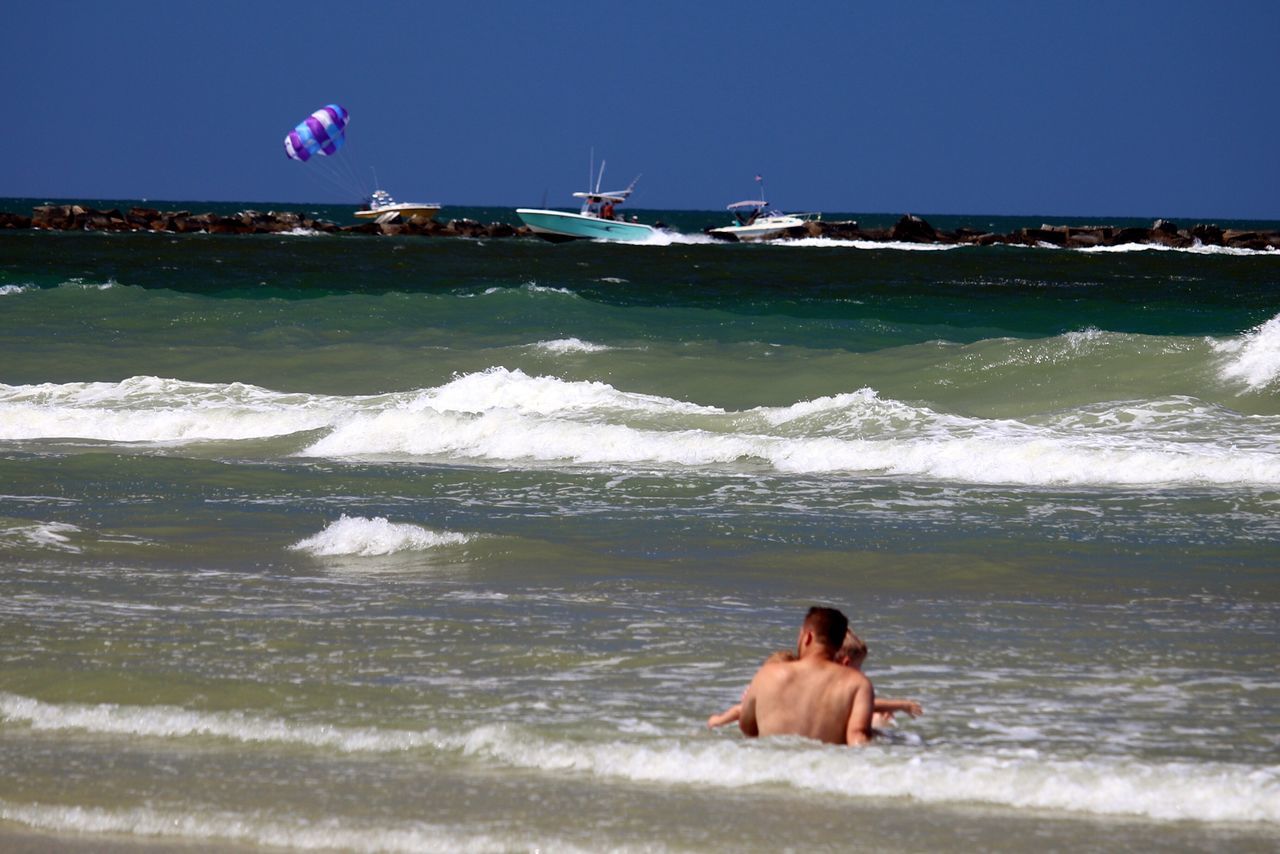 Boats parasailing swimming and boats