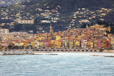 Aerial view of townscape by sea