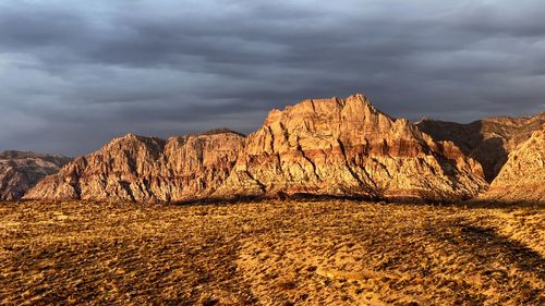 Rock formations on landscape against sky