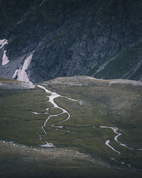 High angle view of river flowing through rocks