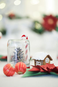 Close-up of christmas decorations with food on table