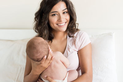 Portrait of happy mother and baby