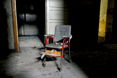 Empty chairs and tables in abandoned building