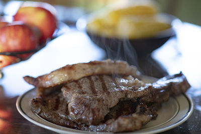 Close-up of meat in plate on table