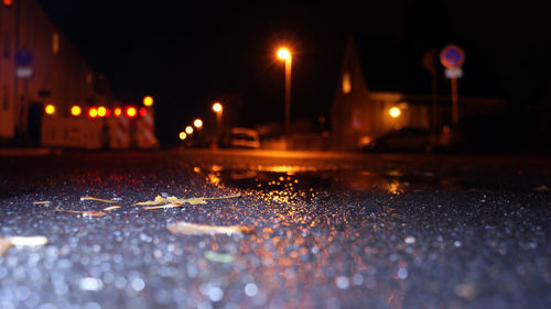 Surface level of wet street at night