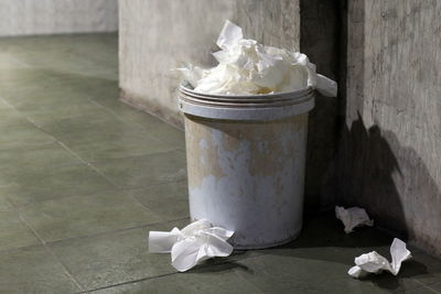 Close-up of papers in garbage bin