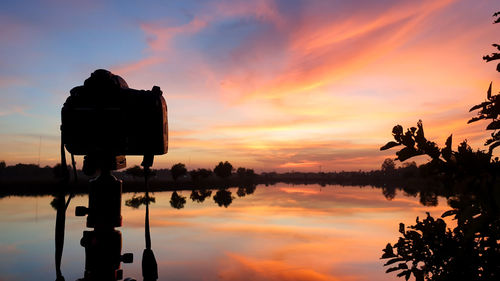 Silhouette built structure against sky during sunset