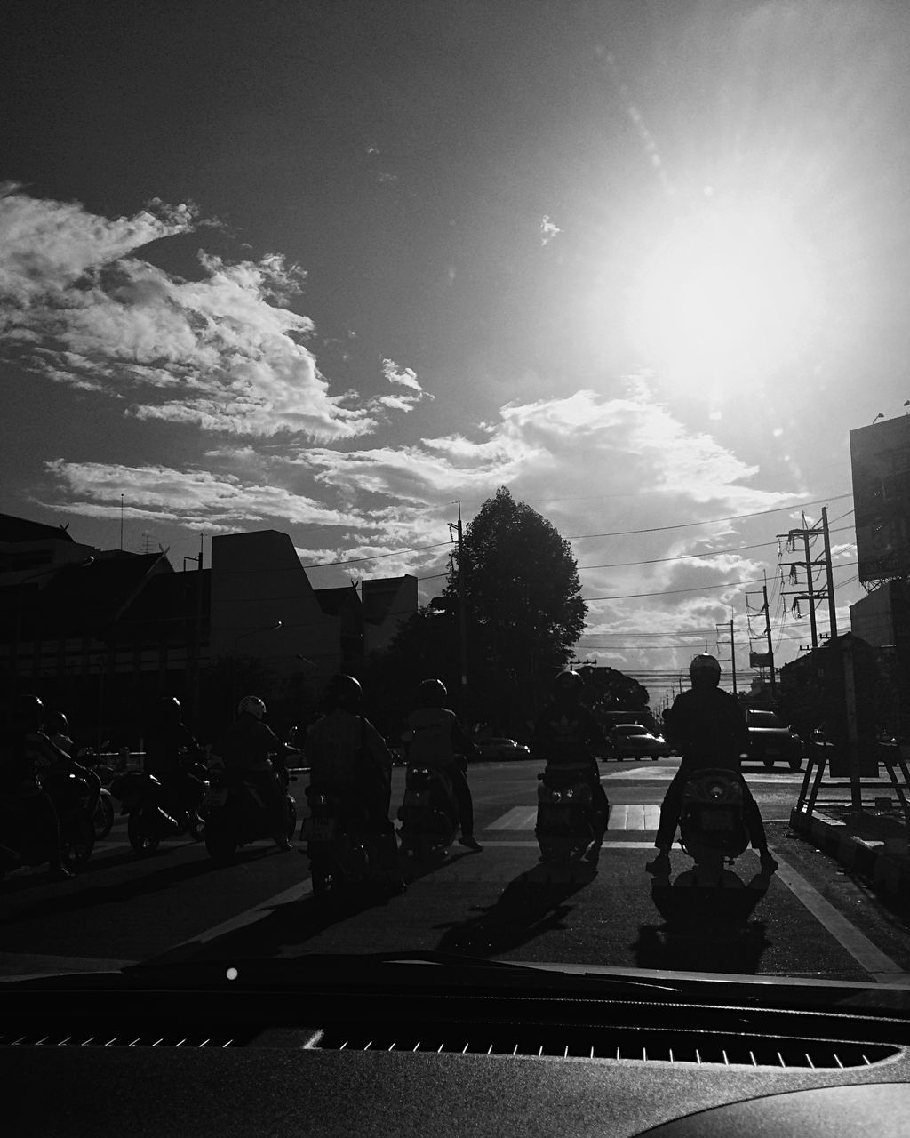 PEOPLE WALKING ON ROAD AGAINST BUILDINGS