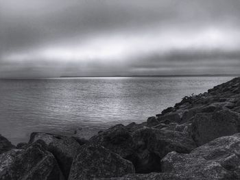 Scenic view of sea against cloudy sky