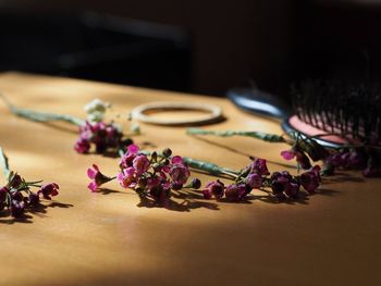 Close-up of messy pink flowers on table