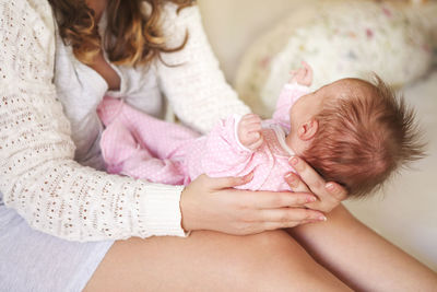 Midsection of mother and daughter