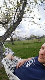 Low angle view of person standing on grassy field