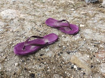 High angle view of purple shoes on sand