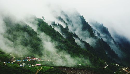 Scenic view of mountains during foggy weather