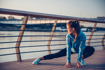 Confident woman exercising in city