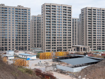 High angle view of buildings in city against sky