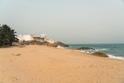 Scenic view of beach against clear sky