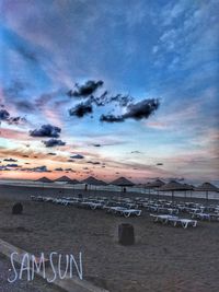 Scenic view of beach against sky during sunset