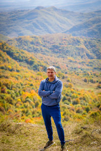 Portrait of man standing on mountain
