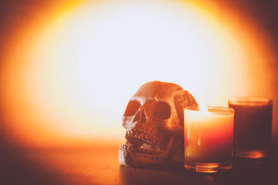 Close-up of orange glass on table