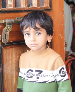 Portrait of cute boy standing outdoors