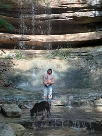 Man with dog in water