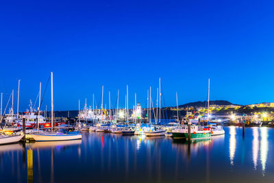 Boats moored at harbor