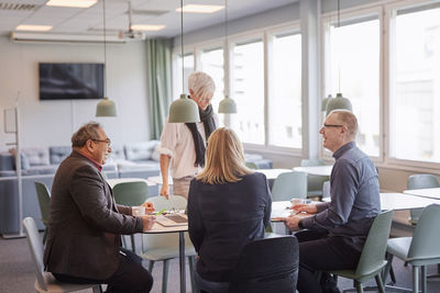 People taking during business meeting