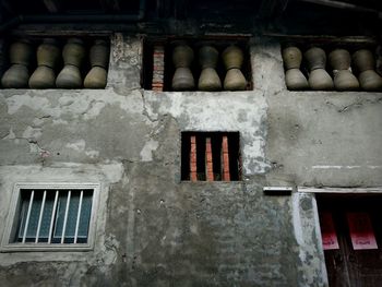 Low angle view of windows on wall