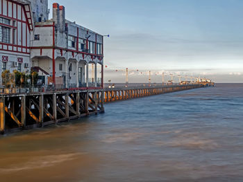 Pier over sea against sky