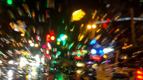 Defocused image of illuminated city at night