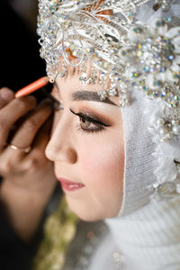 Close-up of young woman looking away